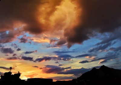 Low angle view of dramatic sky during sunset