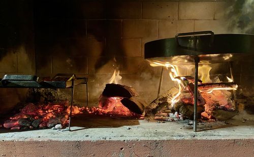 Burning candles on barbecue grill