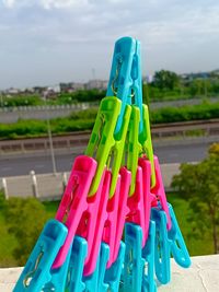 Close-up of multi colored clothespins on playground