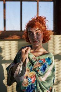 Young alternative redhead girl's portrait with green kimono