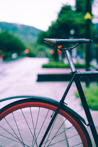 Close-up of bicycle on roadside