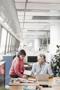 Business colleagues working at desk in office