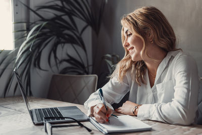 Businesswoman working at table