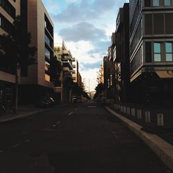 City street against cloudy sky