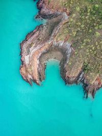 High angle view of rock formation in sea