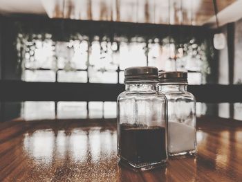 Close-up of glass jar on table