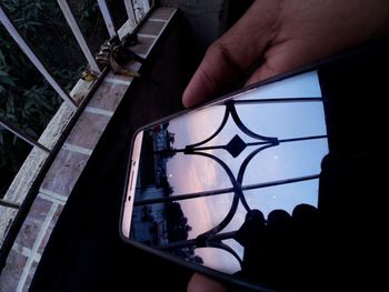 High angle view of man holding glass