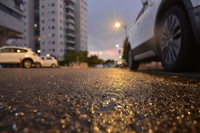 Surface level of wet street at night