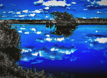 Scenic view of lake against blue sky