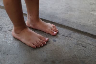 Low section of child standing on floor