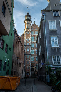 Street amidst buildings in city against sky