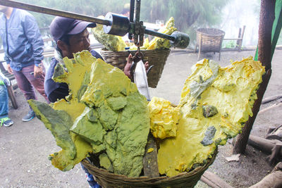 People working on barbecue grill