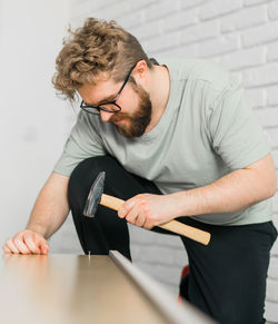 Portrait of young man working at home