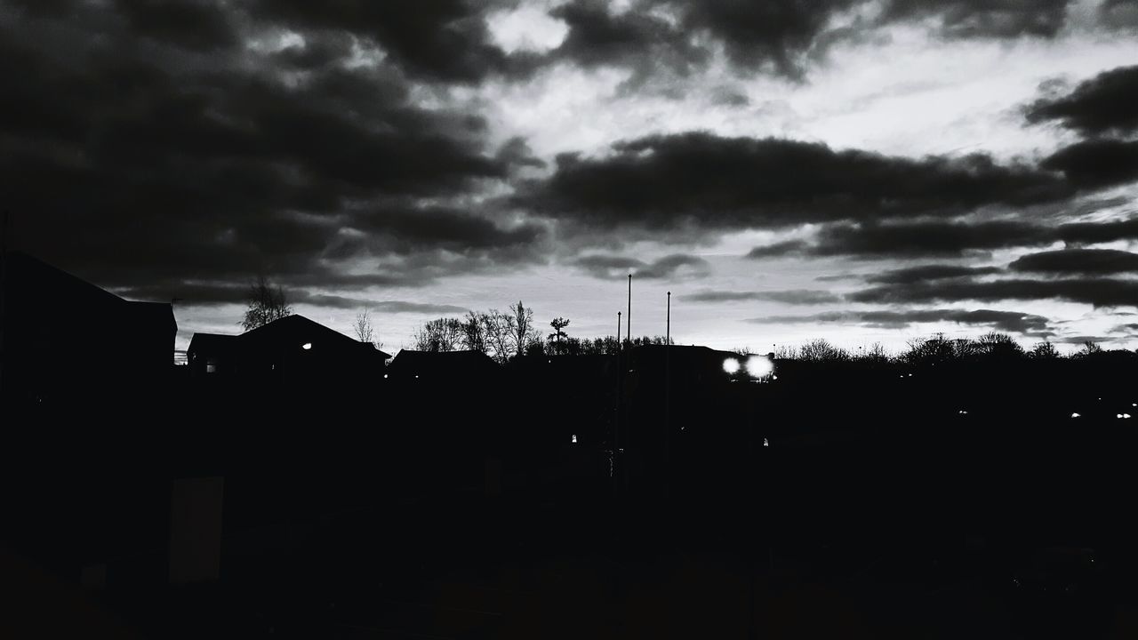 LOW ANGLE VIEW OF STORM CLOUDS IN CITY