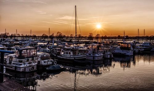 Boats moored at harbor