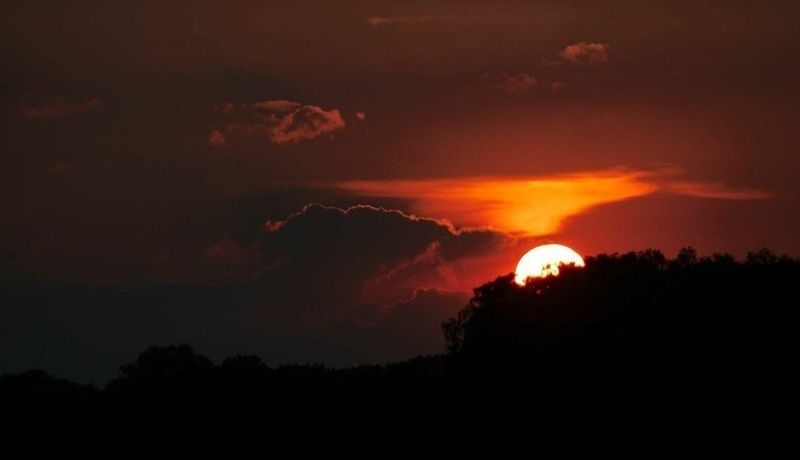 sunset, silhouette, scenics, tranquil scene, beauty in nature, tranquility, sky, idyllic, nature, tree, orange color, mountain, cloud - sky, dramatic sky, dark, majestic, landscape, dusk, outdoors, non-urban scene