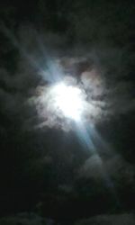 Low angle view of sun in sky