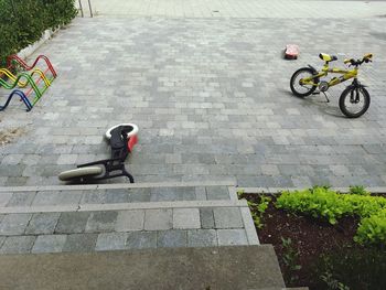 High angle view of bicycle on footpath