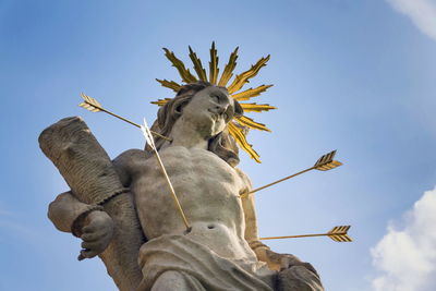 Low angle view of statue against sky