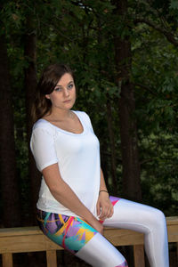 Woman sitting in a forest