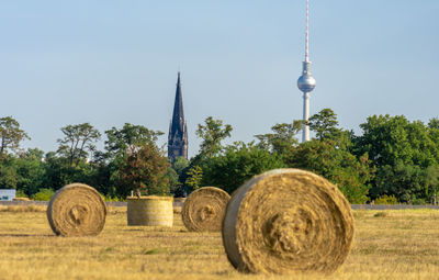 View of hay bales against sky