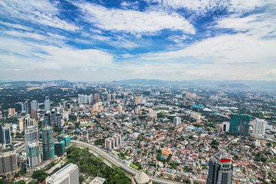 Aerial view of cityscape against sky