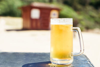 Close-up of beer glass on table