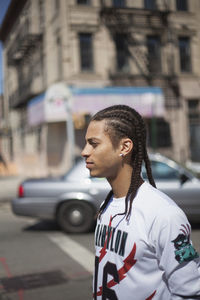Profile of a young man in the street