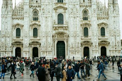 Group of people in front of historic building