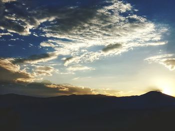 Scenic view of landscape against cloudy sky