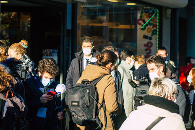 People walking on street in city