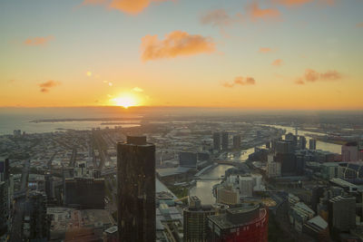 Cityscape against sky during sunset