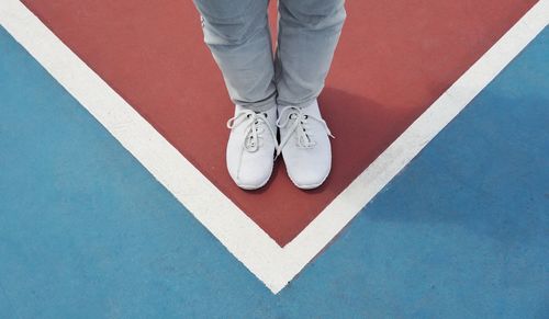 Low section of man standing on floor