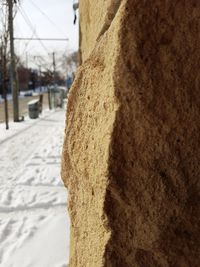 Close-up of snow on brick wall