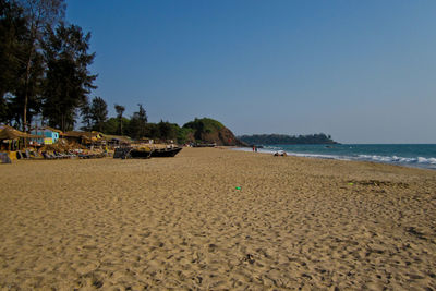 Scenic view of beach against clear sky