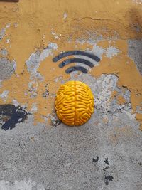 High angle view of yellow art on street