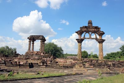 Old ruins of temple against cloudy sky