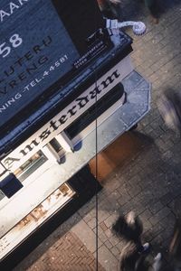 High angle view of people standing on street