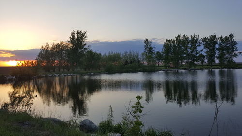 Scenic view of lake at sunset