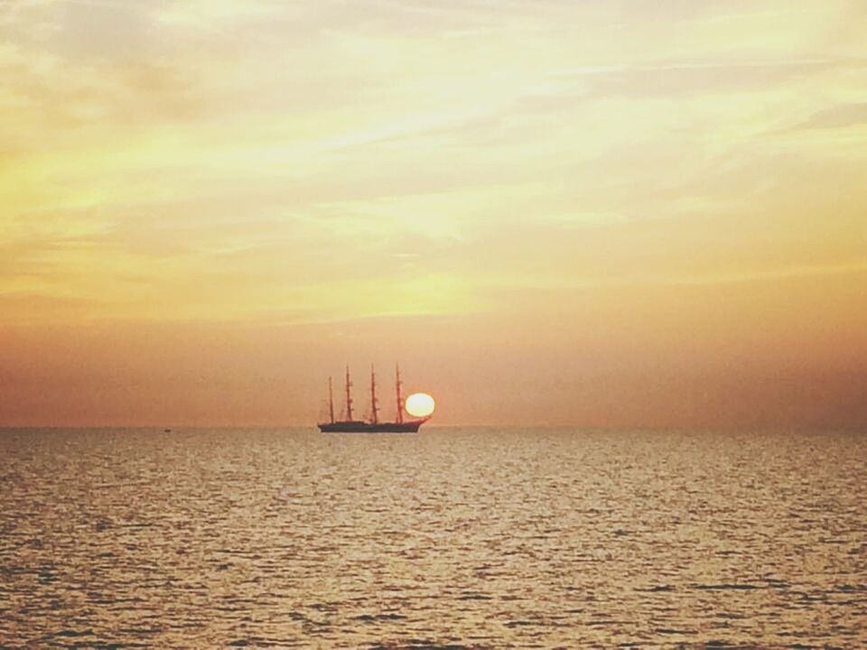 sea, sunset, transportation, water, nautical vessel, horizon over water, waterfront, mode of transport, boat, sky, scenics, tranquil scene, beauty in nature, tranquility, orange color, rippled, sailing, nature, idyllic, cloud - sky