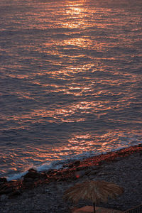 High angle view of sea against sky during sunset
