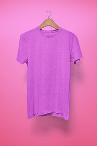 Close-up of pink umbrella against purple background