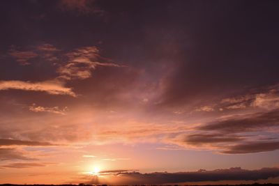 Low angle view of dramatic sky during sunset