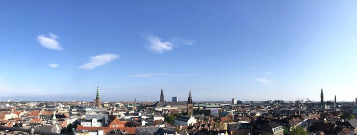 High angle view of townscape against blue sky