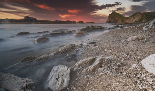 Scenic view of sea against sky during sunset