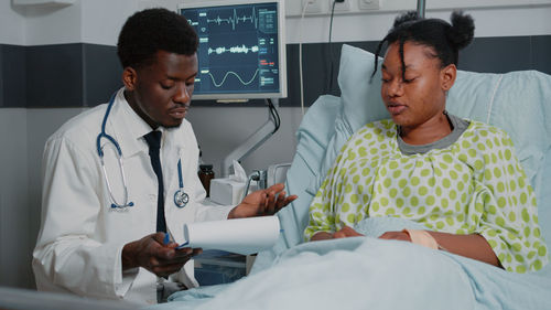 Doctor examining patient at clinic