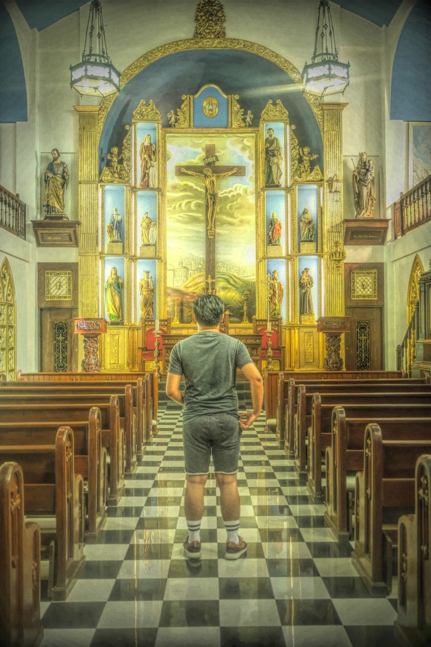 REAR VIEW OF A MAN IN TEMPLE