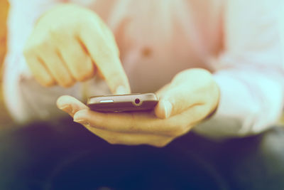 Close-up of hand holding smart phone