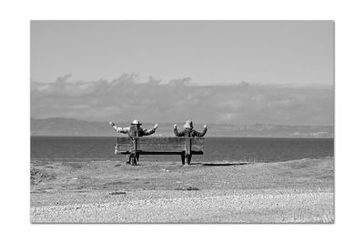 Lifeguard hut on beach against sky