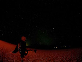 Full length of man against sky at night